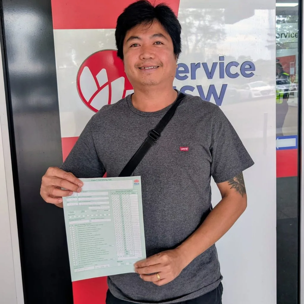 a guy holding green p word card