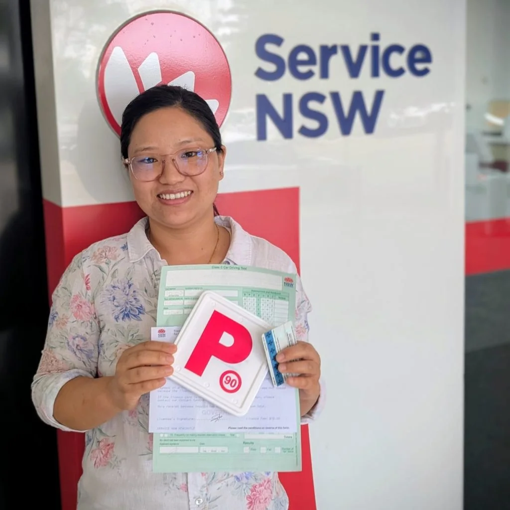 a woman smiling and holding a card